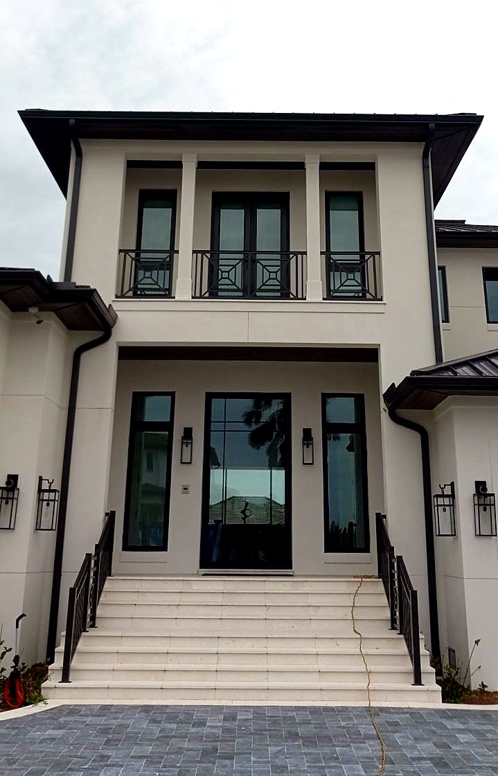 Downspout and gutter detail on two-story home